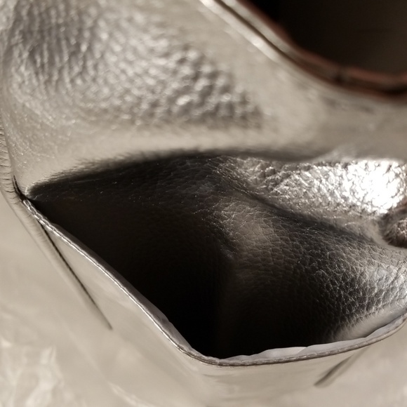 14 H x 18 L x 3 W
CLINIQUE Faux Leather Silver Sho - Picture 7 of 8